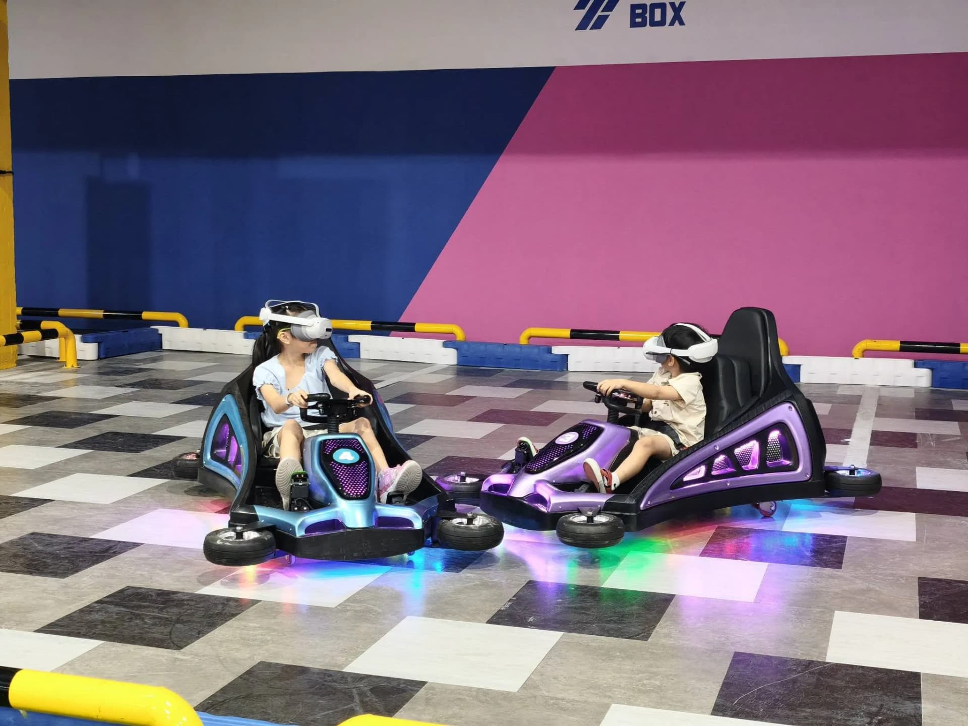 Players in VR headsets on gokarts hunting monsters at AR Battle Kart, The Mall Bangkae