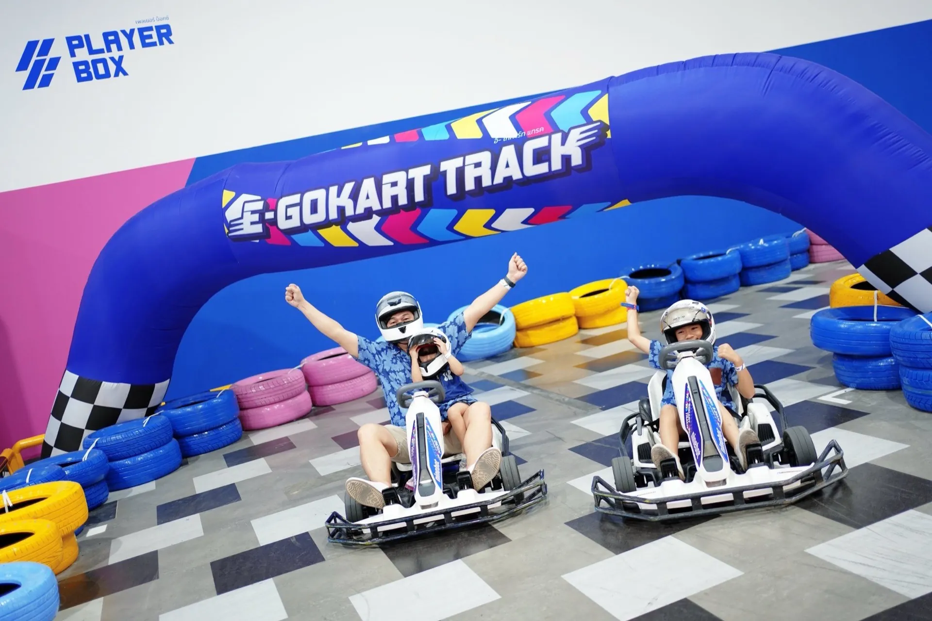 Young driver in racing pose on the Bangkae kart track