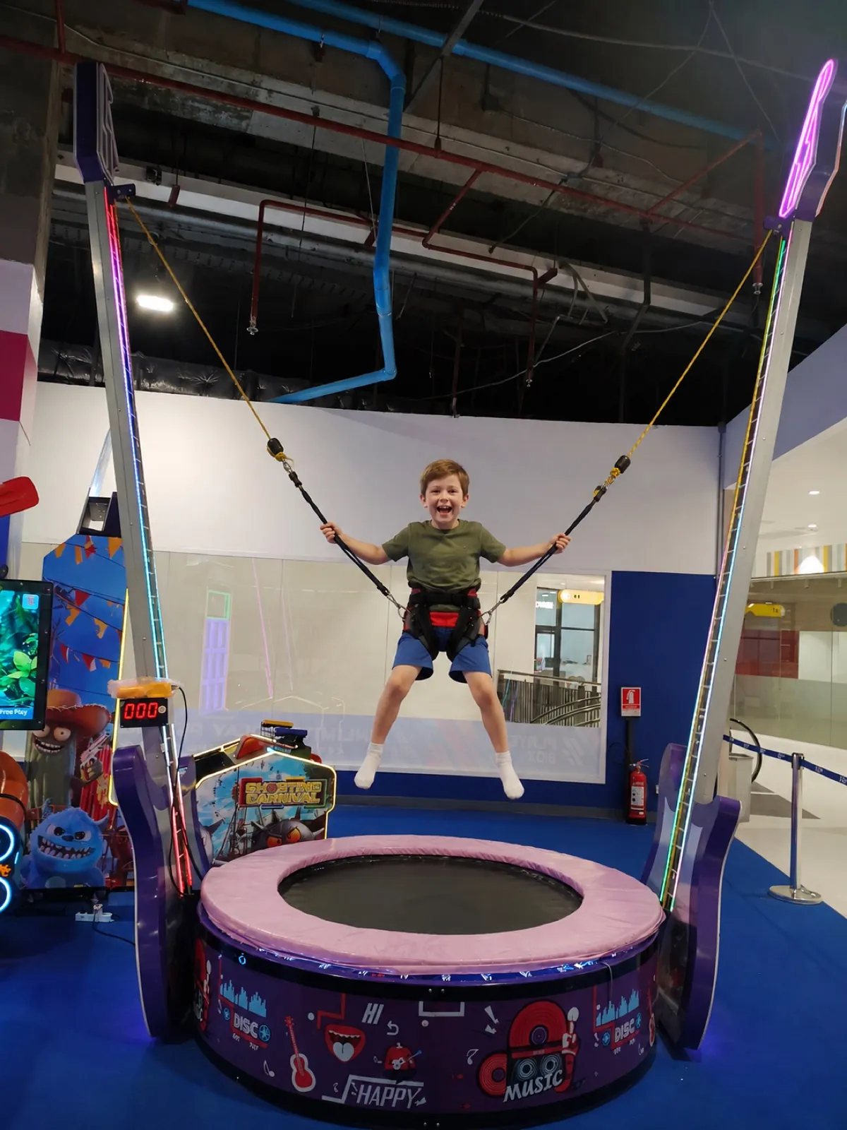 Kids bouncing on Sky Jumper bungee simulator