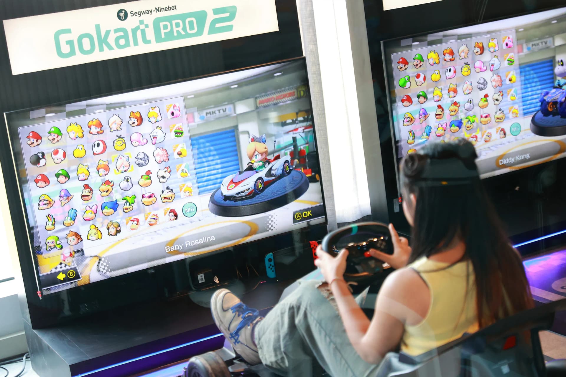 Player selecting a character on the GoKart Pro 2 racing simulator at Siam Discovery Playerbox