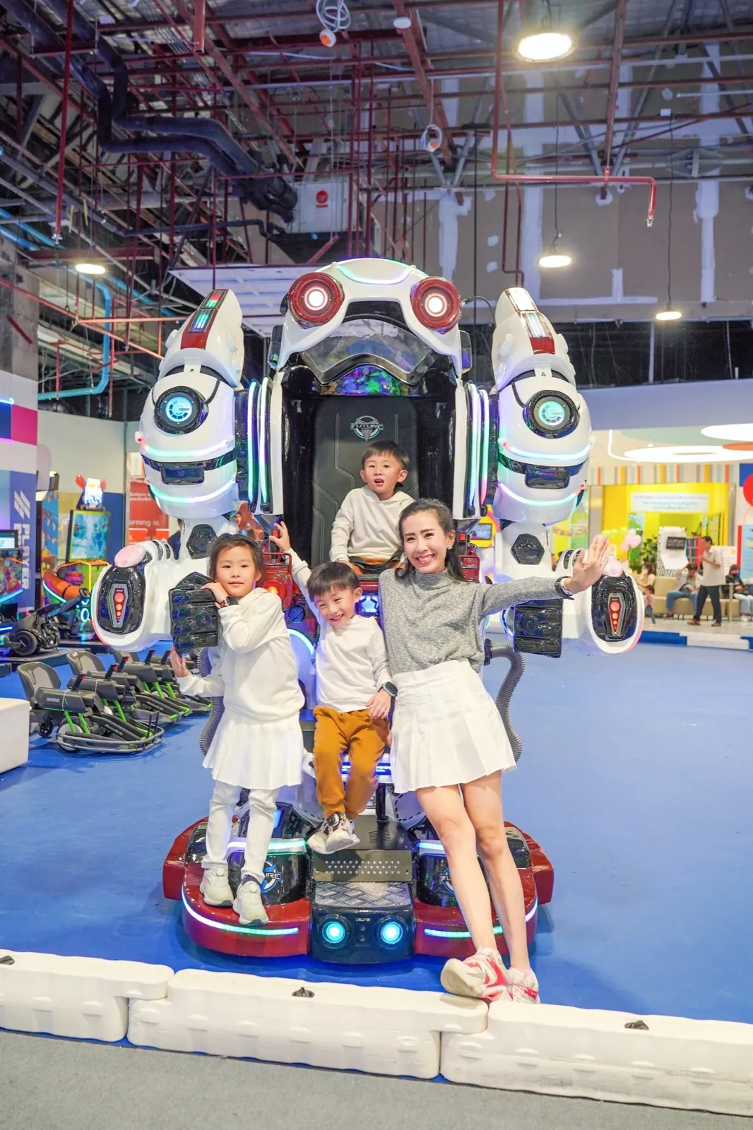 A family with the rideable Robot Rider robot at Central Rama 3