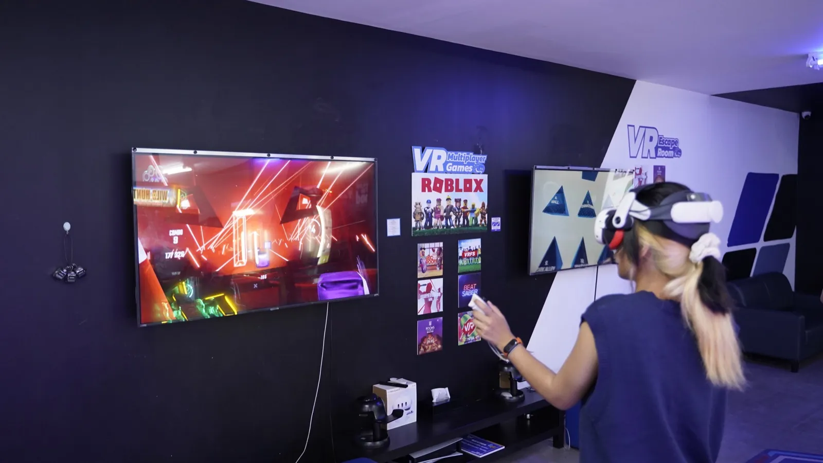 Player in a VR headset playing Beat Saber at Chula 28