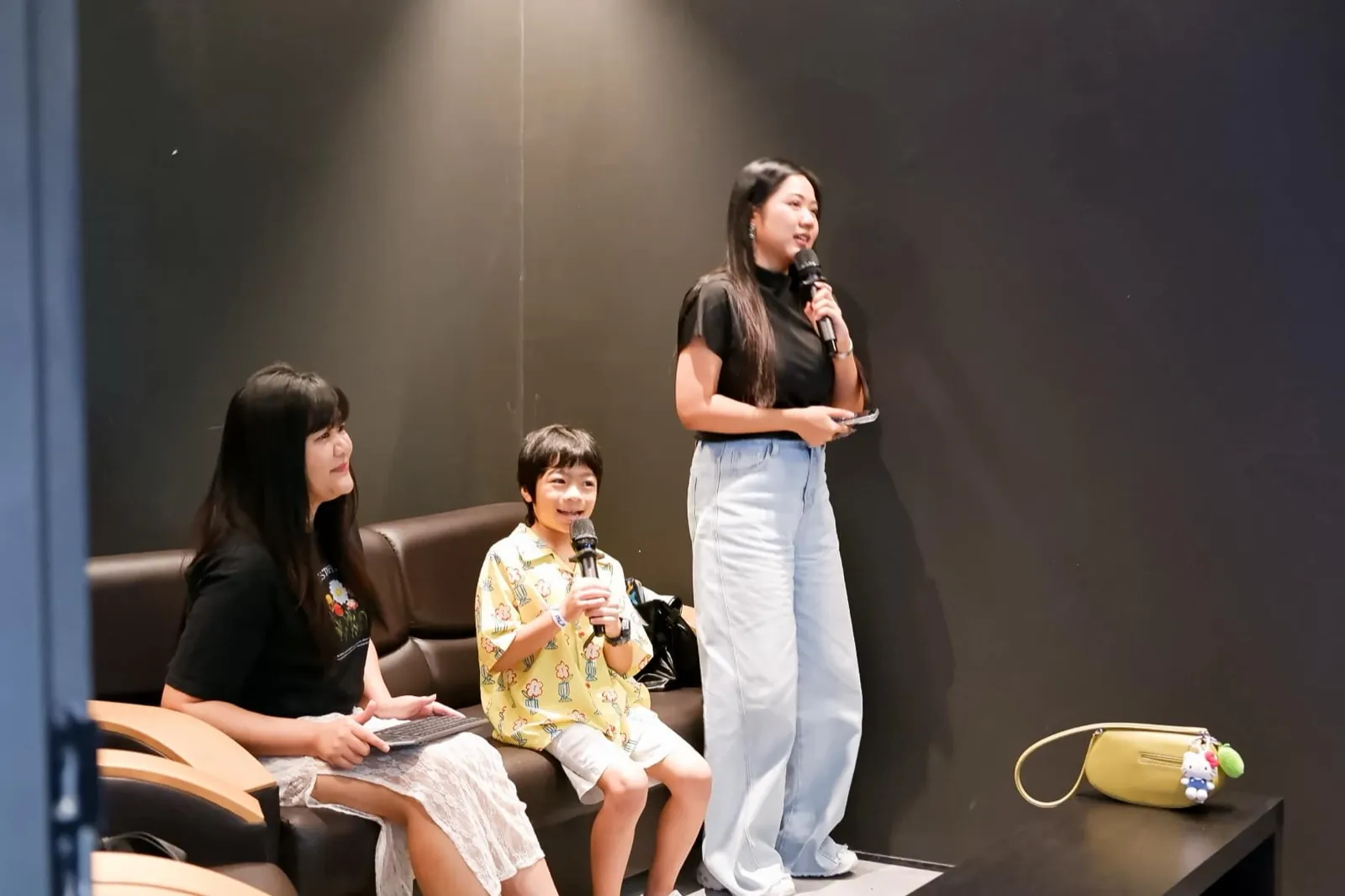 A family singing together in the private karaoke room at Siam Discovery